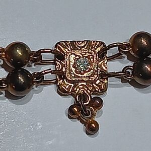 Vintage Elegant Gold-Tone Broche with Intricate Design